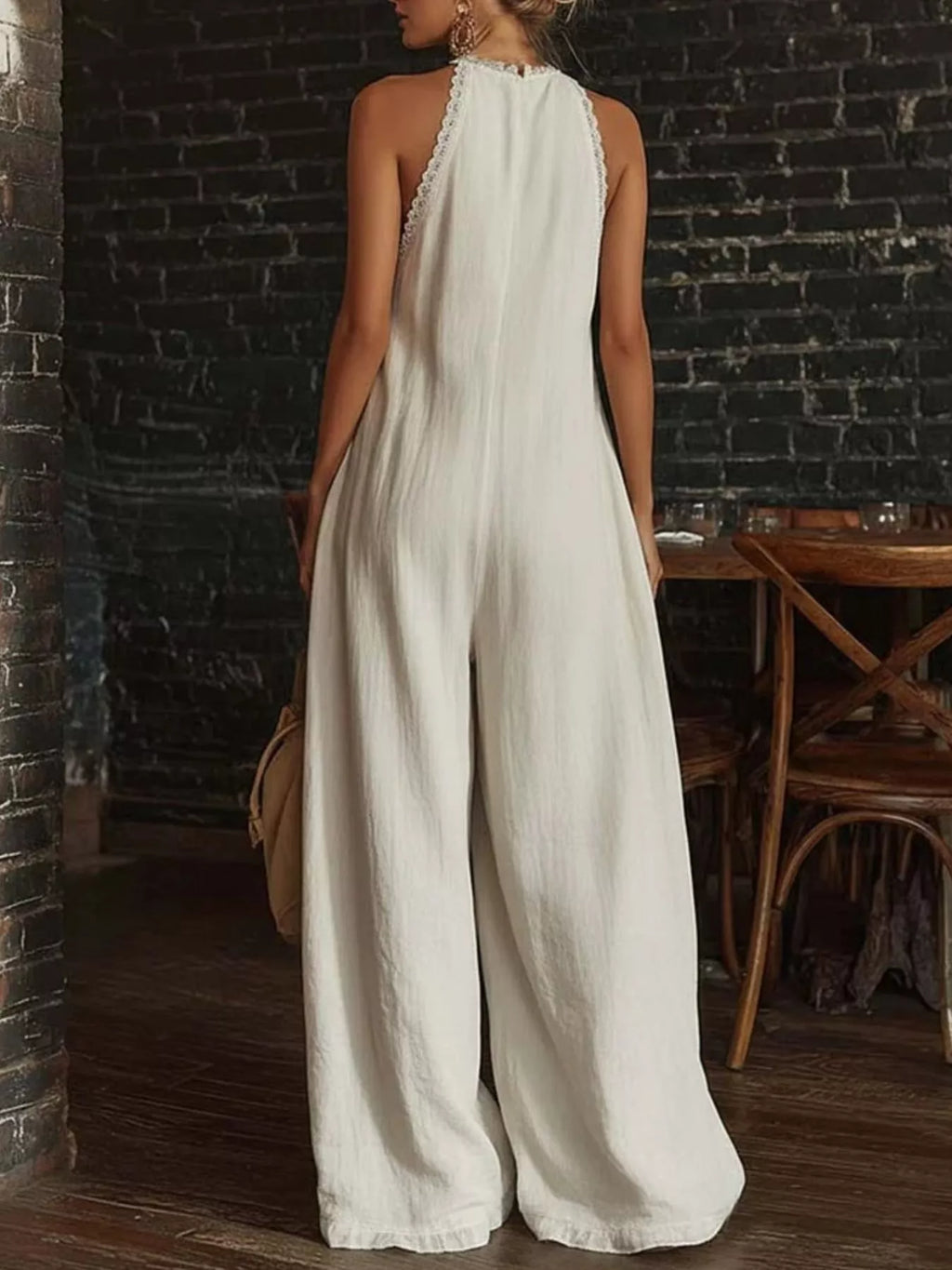 Plus size full size halter neck jumpsuit with lace trim, wide leg design, by Shopimist, shown in a stylish fashion pose.