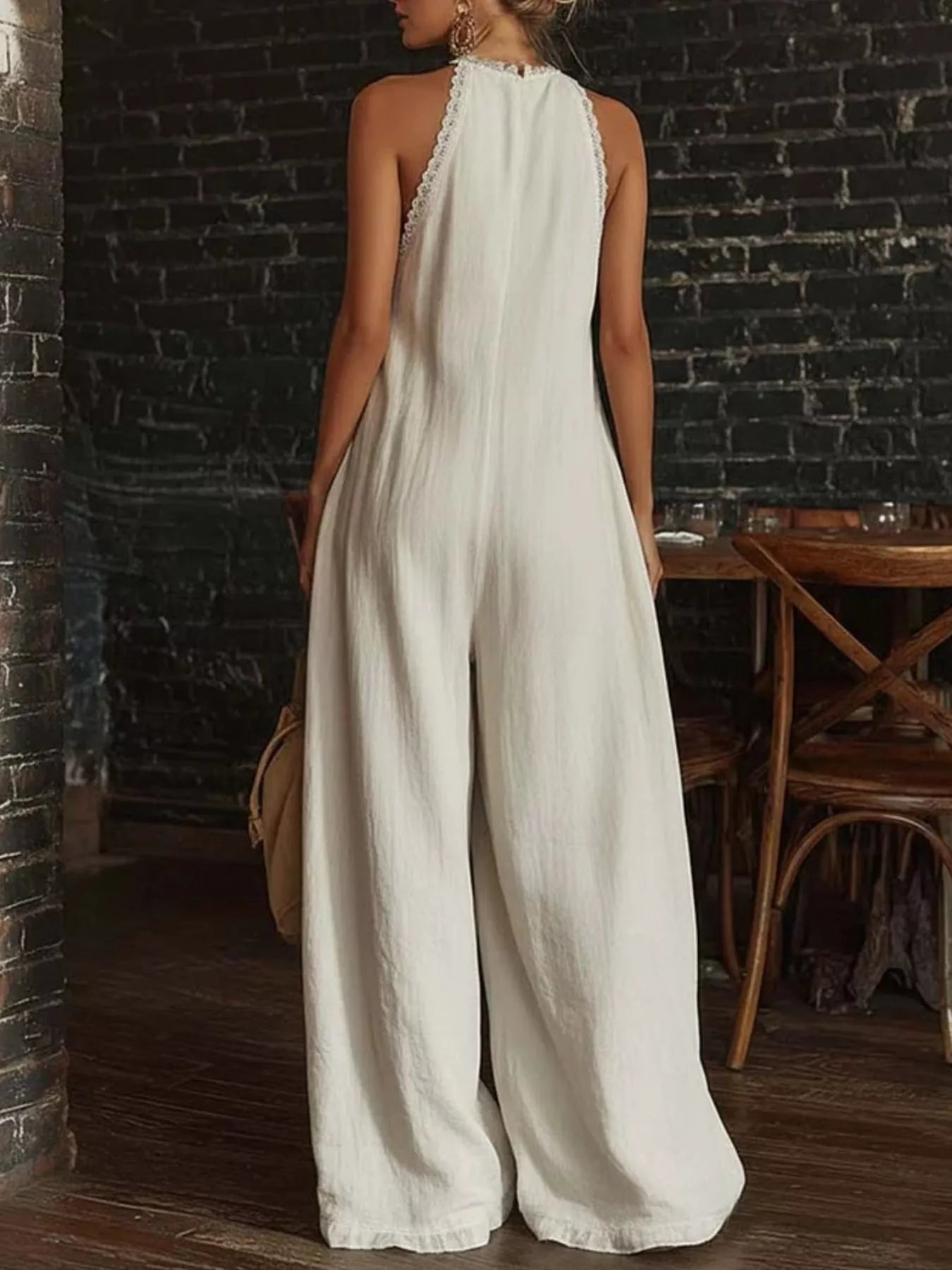 Plus size full size halter neck jumpsuit with lace trim, wide leg design, by Shopimist, shown in a stylish fashion pose.