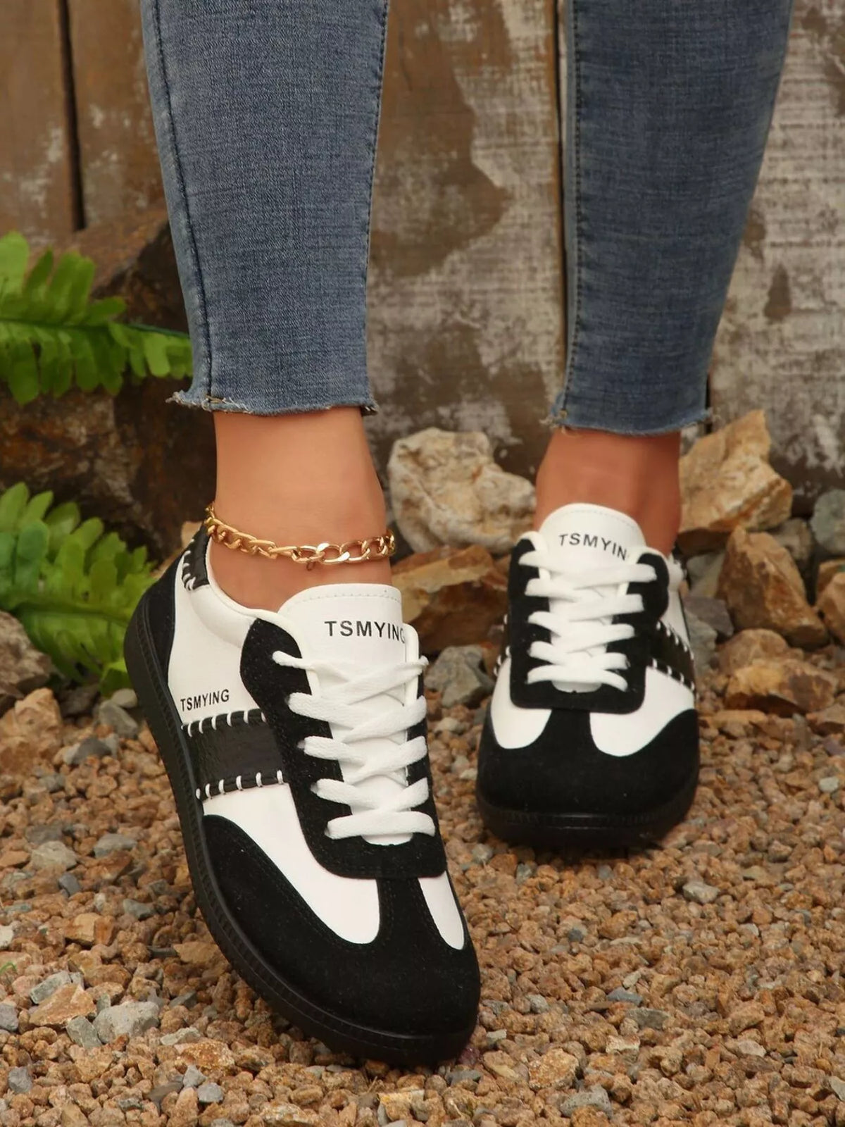 Contrast lace-up sneakers from Trendsi with black and white design, casual footwear with breathable fabric and sturdy sole.