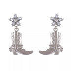 Western style boot dangle earrings with intricate design, crafted by Shopimist, hanging from silver hooks.