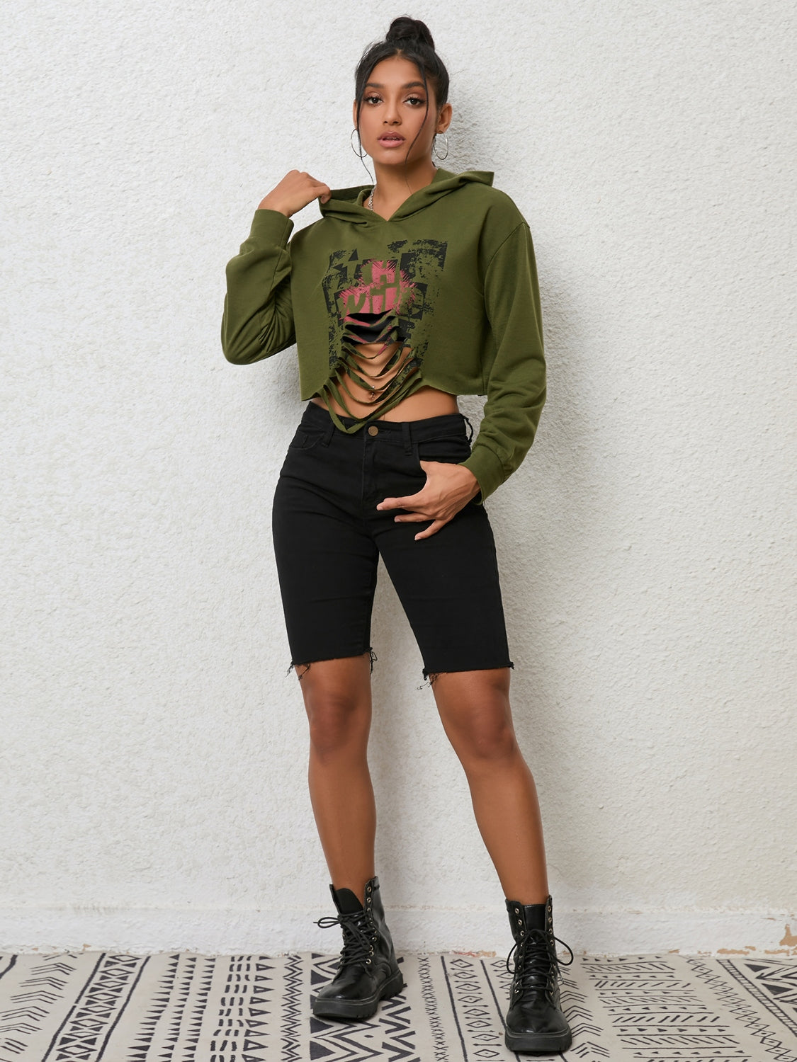 Trendsi cutout long sleeve hoodie featuring a stylish design, with a hood and unique cutout details on the sleeves and back.