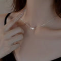 Sterling silver pearl necklace with elegant white pearls and delicate chain, crafted by Shopimist.