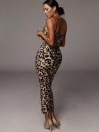 Leopard print spaghetti strap midi dress by Shopimist, featuring a fitted silhouette and stylish design for casual or dressy occasions.