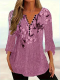 Women’s printed spike button three-quarter sleeve casual top by Plush Fashion Hub, featuring a colorful design and relaxed fit.