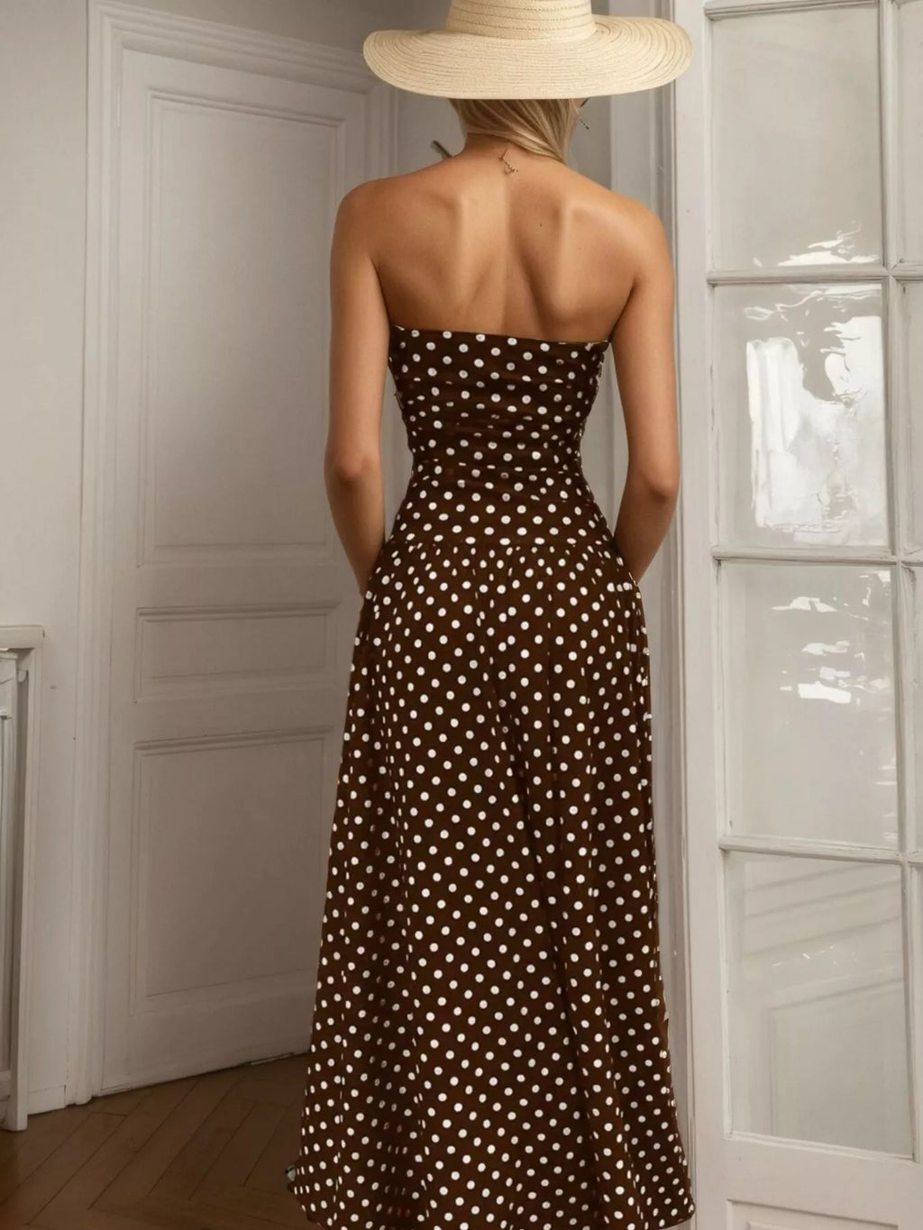 Polka dot strapless maxi dress by Shopimist featuring a flowing silhouette and bold black and white pattern.