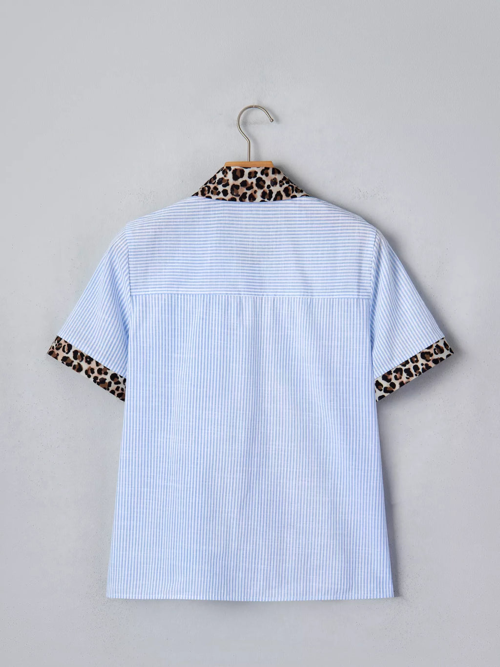 Women's leopard print short sleeve dress with contrast collar by Plush Fashion Hub, featuring stylish animal print and casual design.