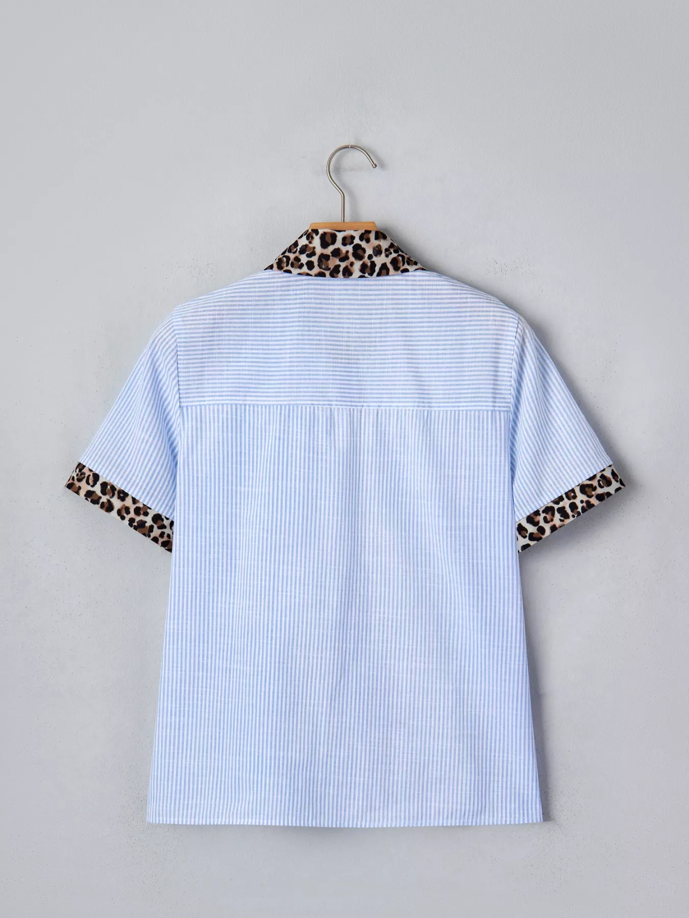 Women's leopard print short sleeve dress with contrast collar by Plush Fashion Hub, featuring stylish animal print and casual design.