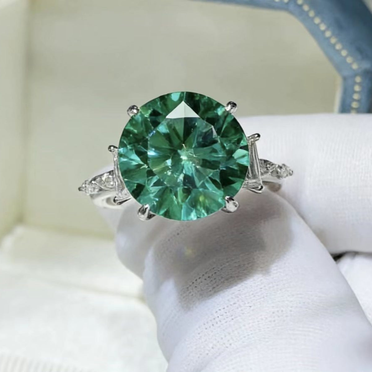 Sterling silver ring with an 8-carat moissanite gemstone, showcasing a sparkling, elegant jewelry design.