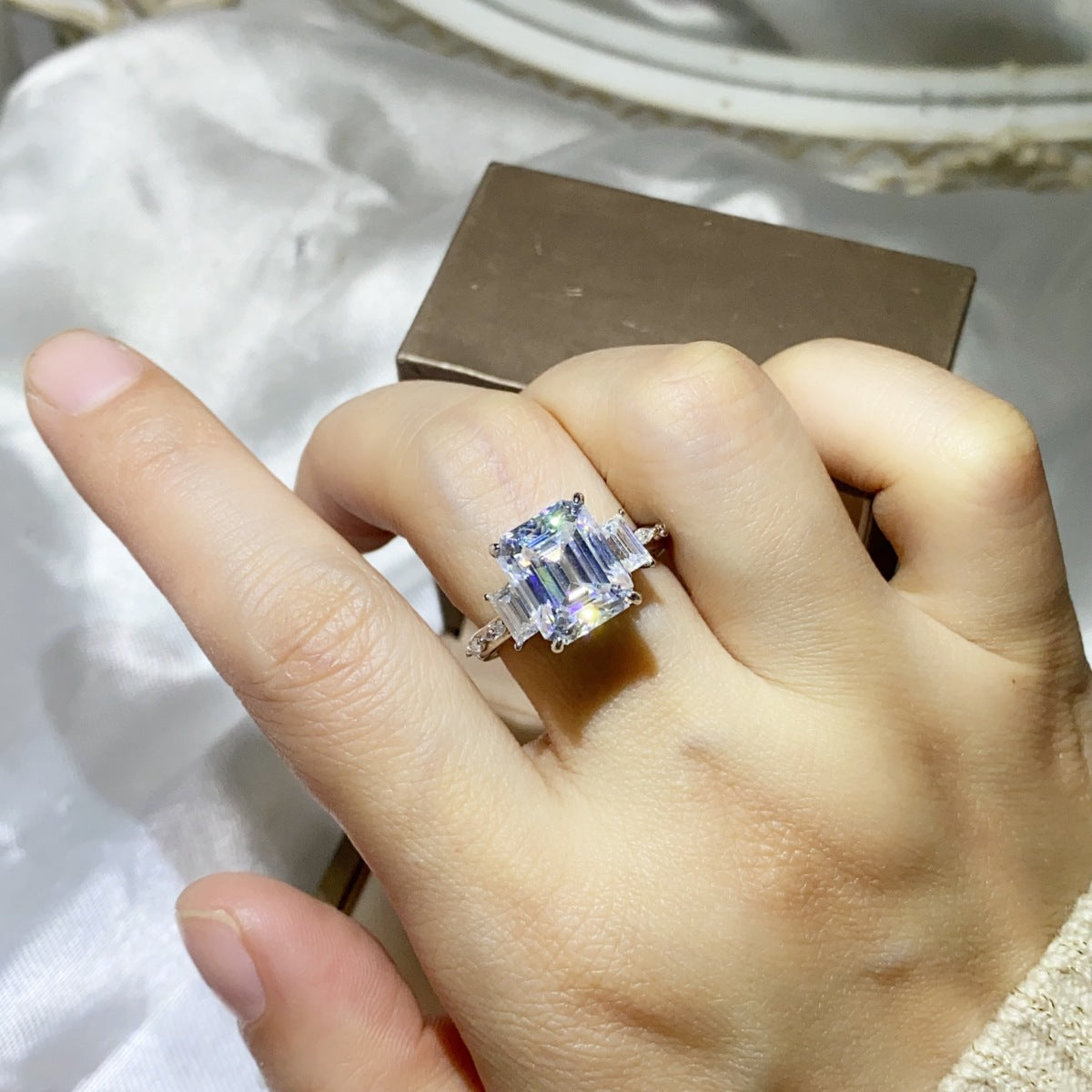Sterling silver ring with a 5-carat moissanite gemstone, featuring a sleek and elegant design.