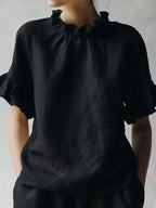 Plus size Shopimist ruffled neck half sleeve blouse with a full-size fit, featuring elegant ruffle details and a comfortable fit.