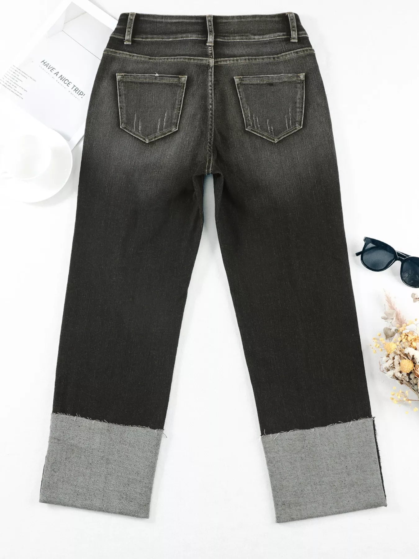 Light-wash high waist distressed straight leg jeans from Trendsi, featuring ripped details and classic denim style.
