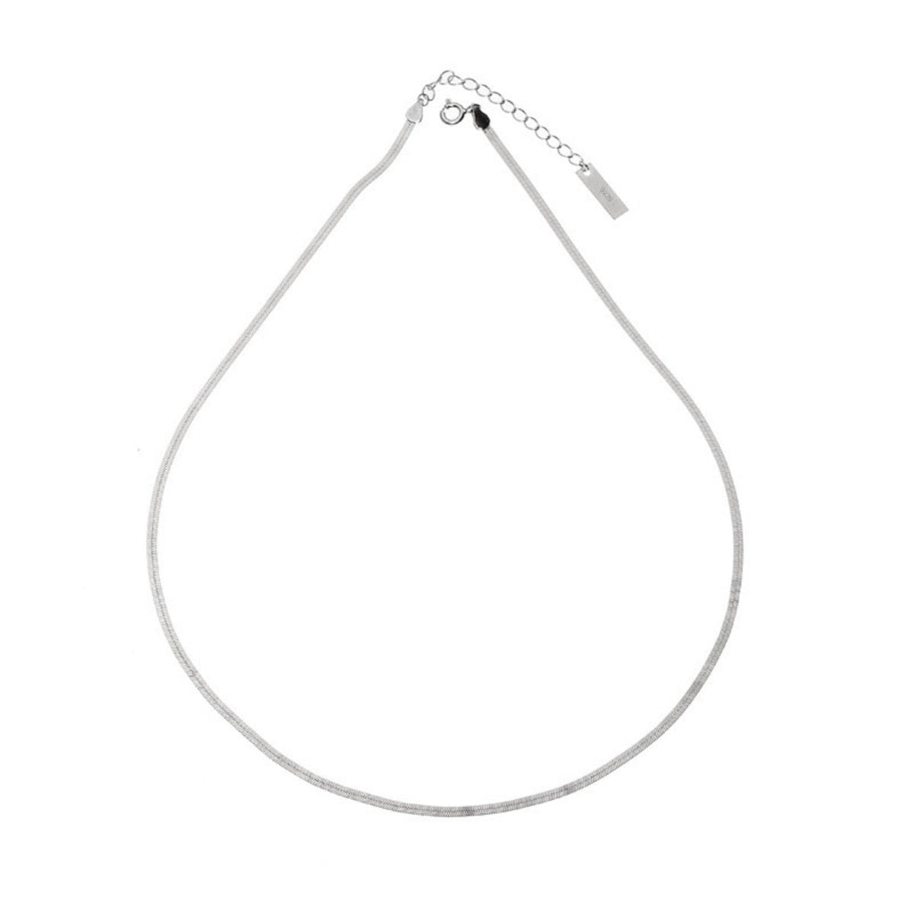 Sterling silver chain necklace by Shopimist with intricate links, showcasing a shiny, polished finish on a plain background.