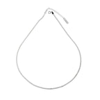 Sterling silver chain necklace by Shopimist with intricate links, showcasing a shiny, polished finish on a plain background.