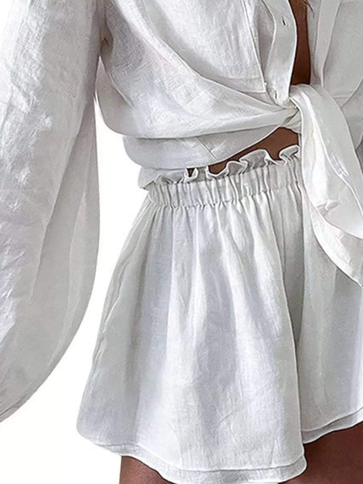 Plush Fashion Hub two-piece set with a button-up long sleeve shirt and matching shorts, made from soft, plush fabric.