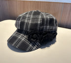 Plush Fashion Hub checkered beret in warm fabric, designed for autumn and winter, shown in a stylish close-up shot.