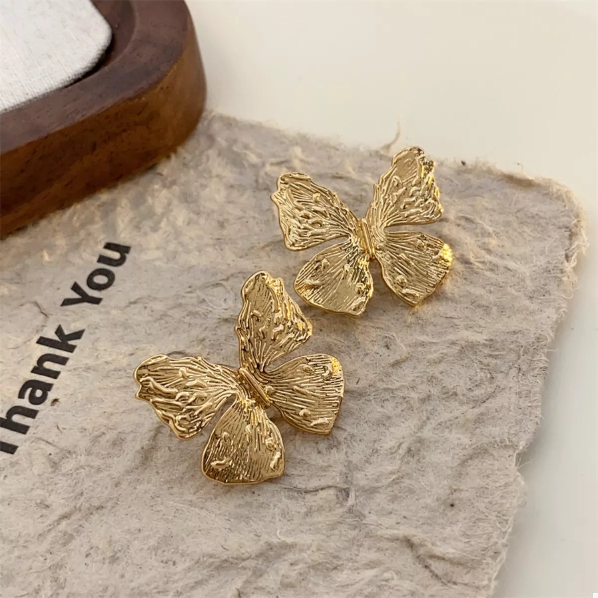 18K gold-plated textured stud earrings with a sleek, modern design, perfect for everyday wear and elegant style.