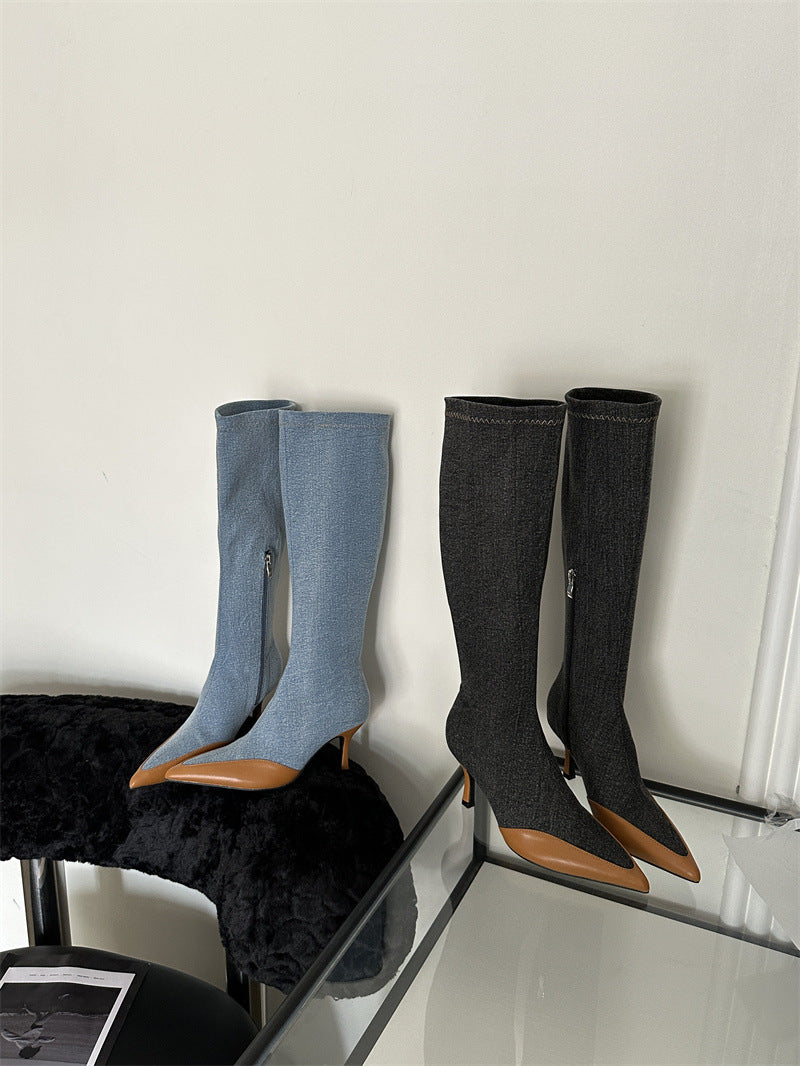 Two pairs of knee-high denim boots with pointed brown leather toes and stiletto heels.