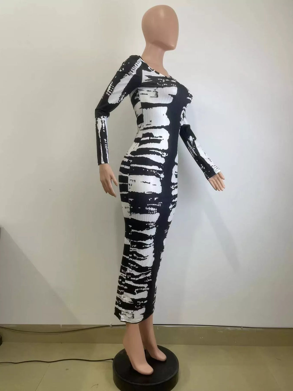 Colorful tie-dye long sleeve maxi dress by Shopimist featuring a flowing silhouette and vibrant pattern.
