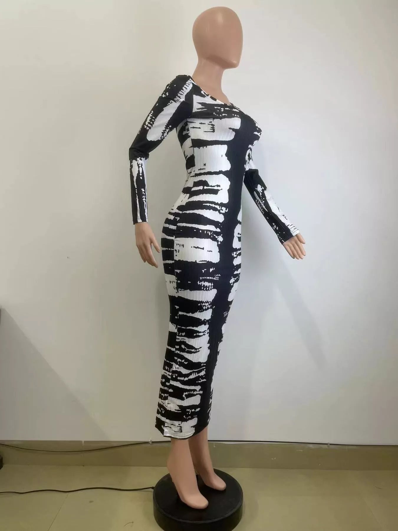 Colorful tie-dye long sleeve maxi dress by Shopimist featuring a flowing silhouette and vibrant pattern.