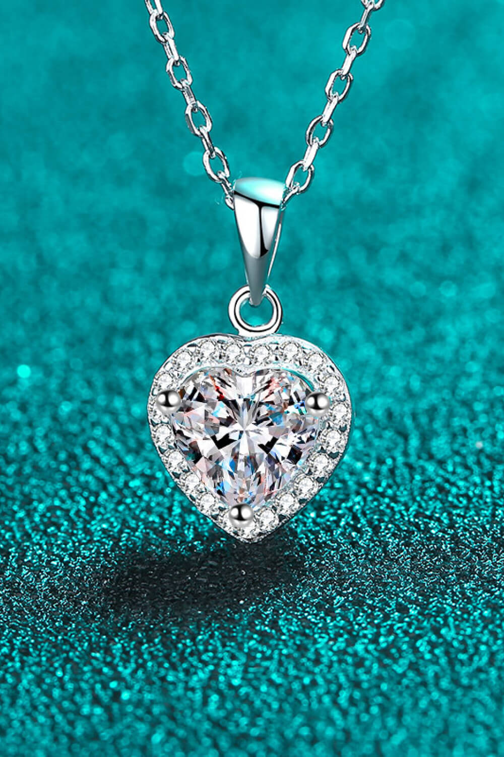 Moissanite heart pendant necklace with chain, 1 carat, elegant jewelry piece from Plush Fashion Hub, showcasing sparkling heart design.