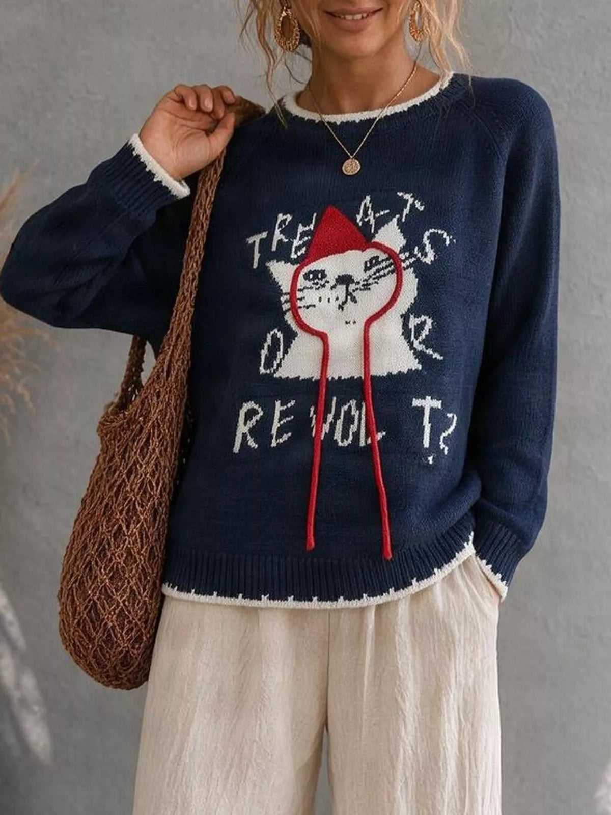 Cat raglan sleeve sweater by Trendsi featuring a cozy knit design and colorful cat print on the front.