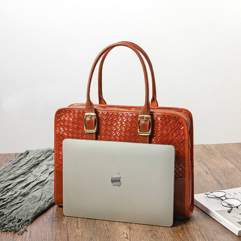Women's hand-woven handbag made of vegetable-tanned full-grain cowhide leather, showcasing intricate craftsmanship and natural texture.
