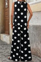 Polka dot sleeveless top and wide-leg pants two-piece set from Trendsi, featuring a stylish polka dot pattern and relaxed fit.