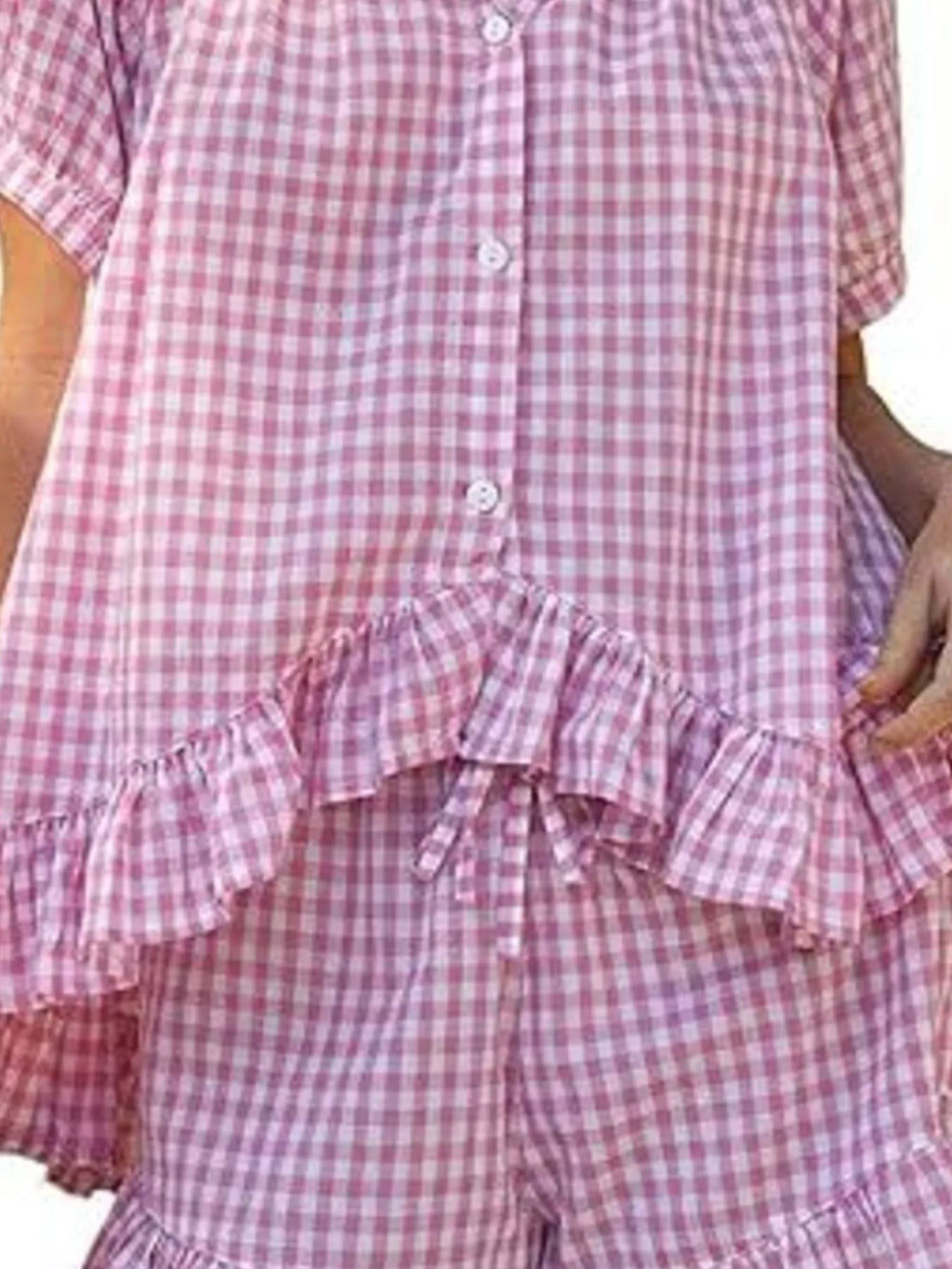 Gingham ruffle trim top and shorts set by Trendsi, featuring a stylish matching two-piece with ruffled details and a classic gingham pattern.