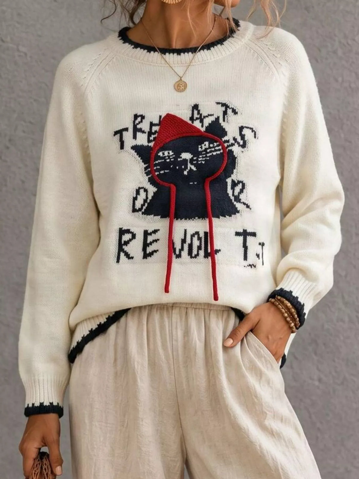 Trendsi cat raglan sleeve sweater featuring a cozy knit design with contrasting sleeve colors and a relaxed fit.