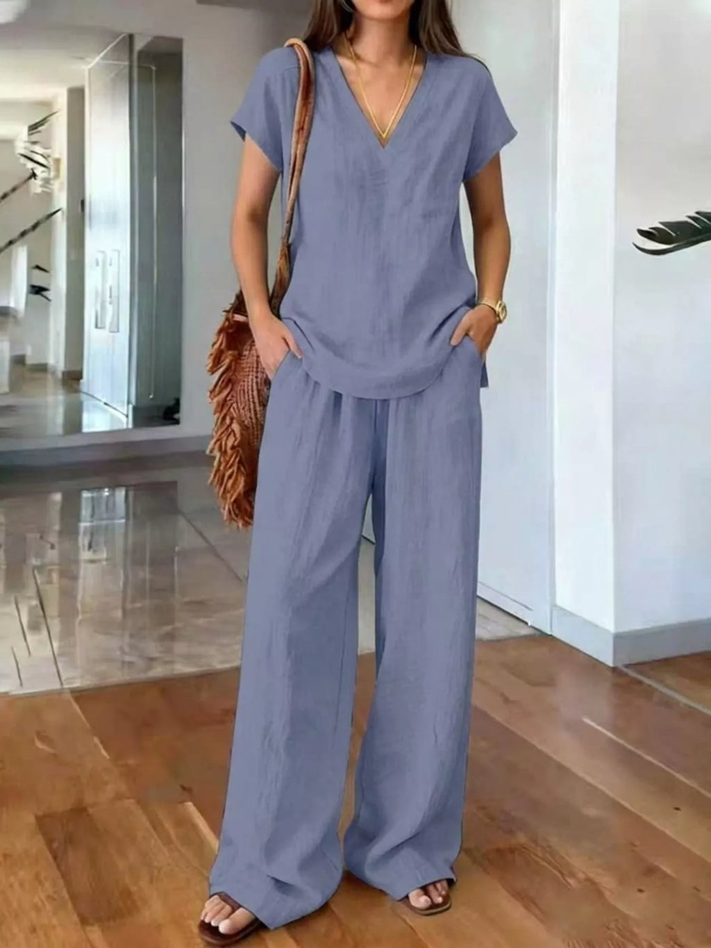 Plus size Trendsi loungewear set with v-neck short sleeve top and matching pants, comfortable and stylish for relaxed wear.