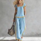 FitiqueFit square-neck three-quarter sleeve loose top and matching pants two-piece set shown on a model.