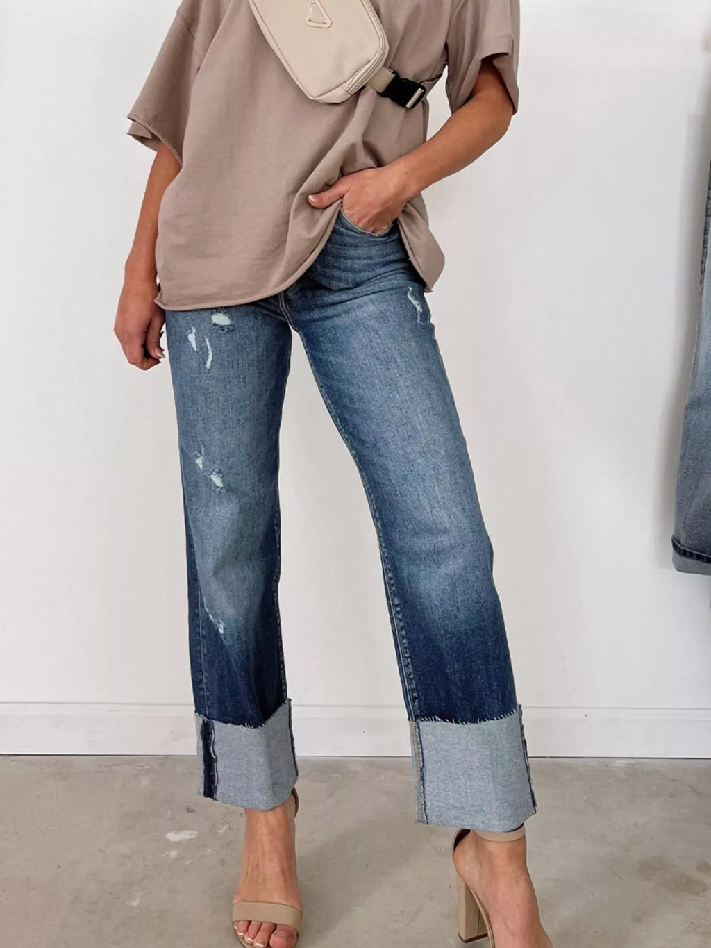 High waist distressed straight leg jeans by Trendsi, showing front view with ripped details and classic denim texture.