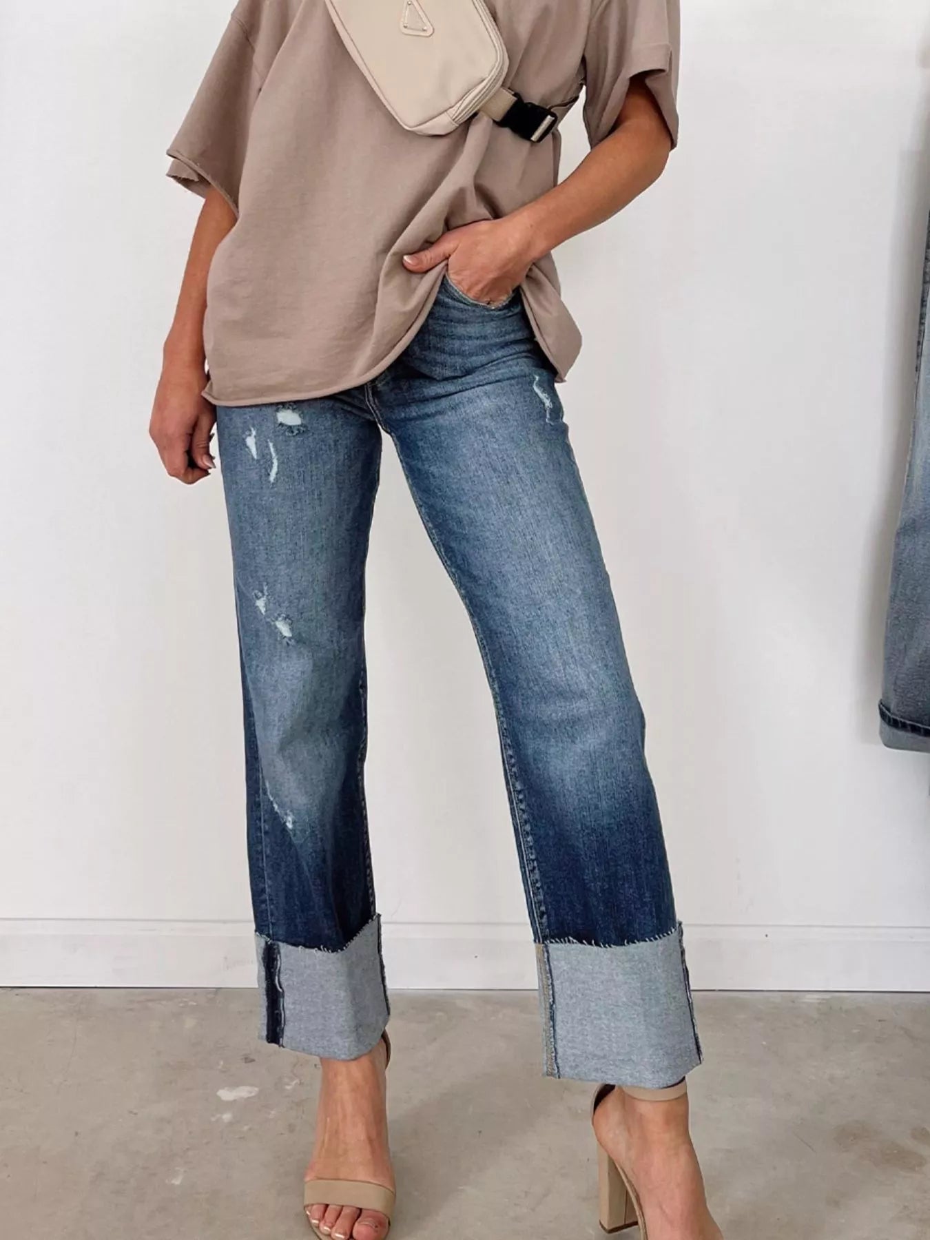 High waist distressed straight leg jeans by Trendsi, showing front view with ripped details and classic denim texture.
