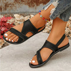Shopimist crisscross mesh sandals with open toes and ankle straps, featuring stylish woven design and comfortable flat soles.