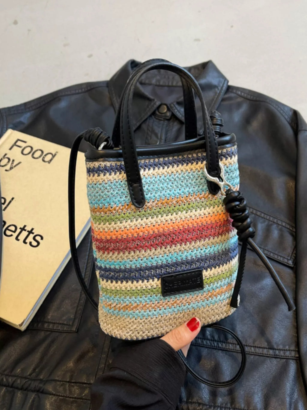 Striped woven mini crossbody bag from Trendsi featuring a compact design with adjustable strap and colorful striped pattern.