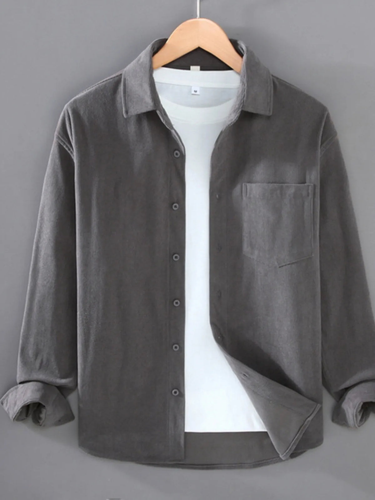 Men's plus size button-up long sleeve shirt by Trendsi, featuring a casual fit and classic collar, shown in a front view.