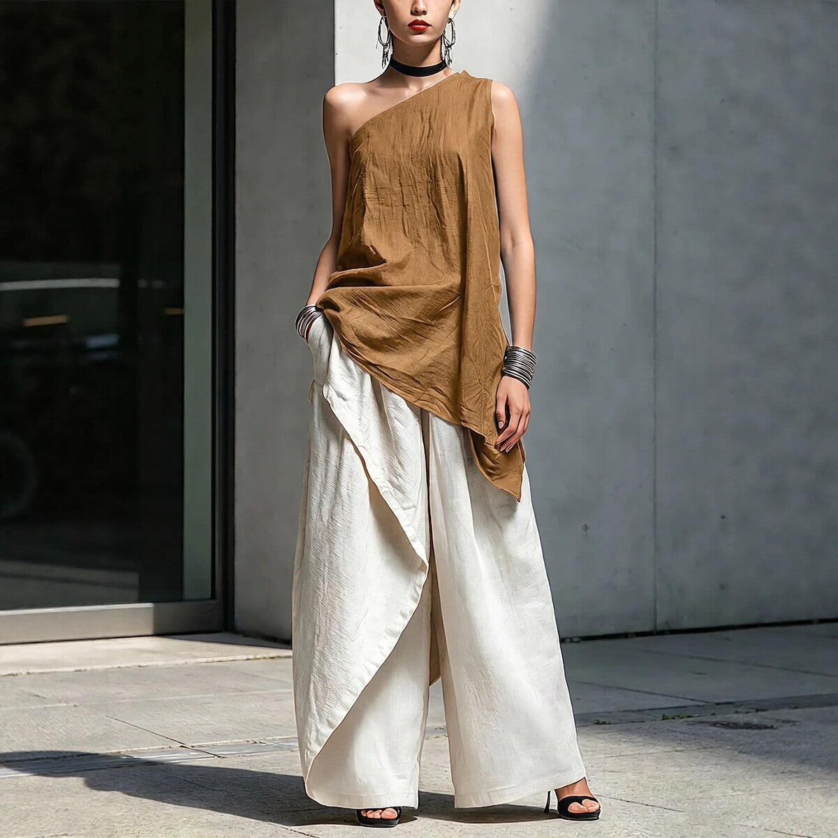 Women's one-shoulder asymmetric sleeveless top by Plush Fashion Hub, shown in a stylish, modern design.