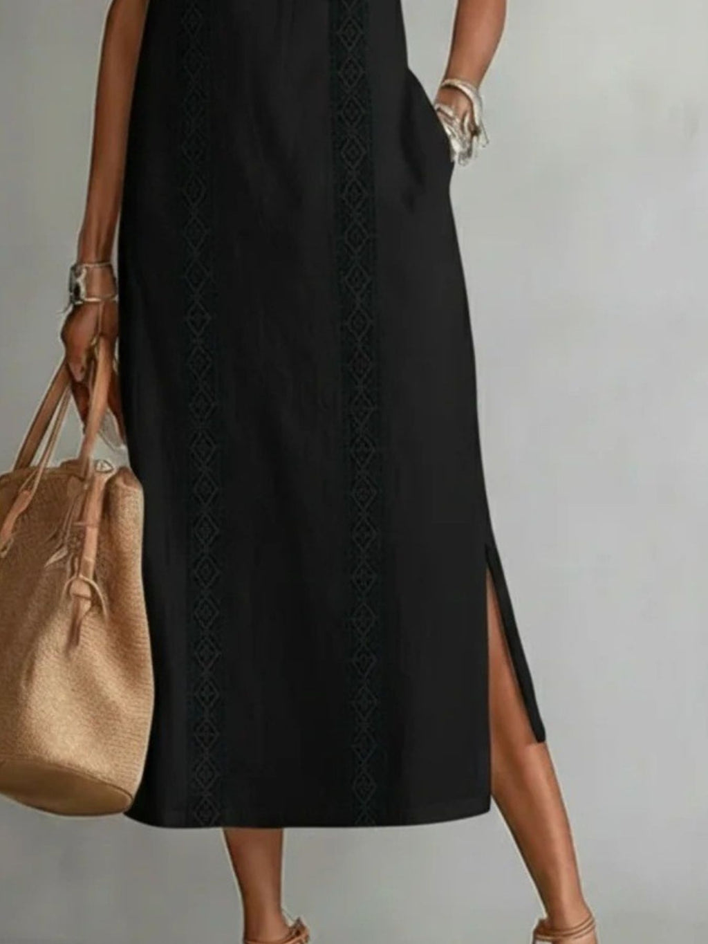 Sleeveless hollow-out midi dress with side slit and pockets from Plush Fashion Hub, shown in a stylish, fitted design.