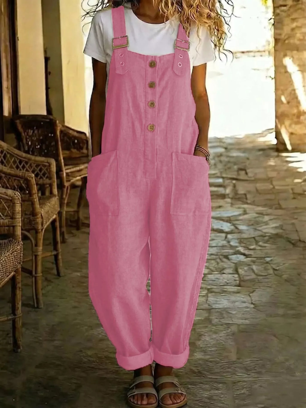 Casual button-front wide-leg overalls by Shopimist, featuring a relaxed fit and adjustable straps, worn with a striped shirt.