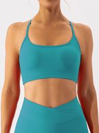 Black spaghetti strap active bra from Trendsi, featuring a sleek design and adjustable straps for comfortable workout wear.