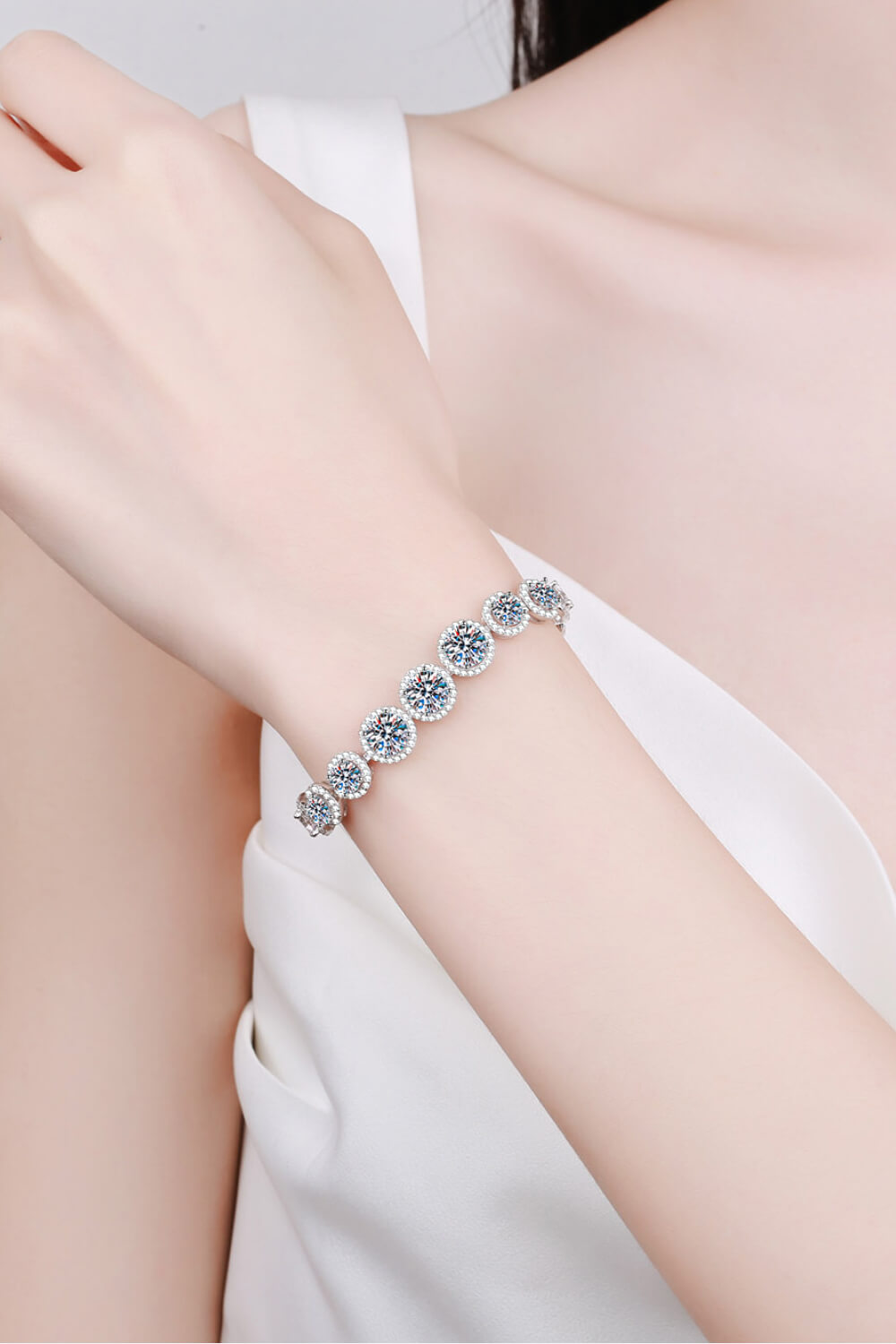 Sterling silver bracelet with sparkling 10.4 carat moissanite stones, showcasing elegant jewelry design and craftsmanship.