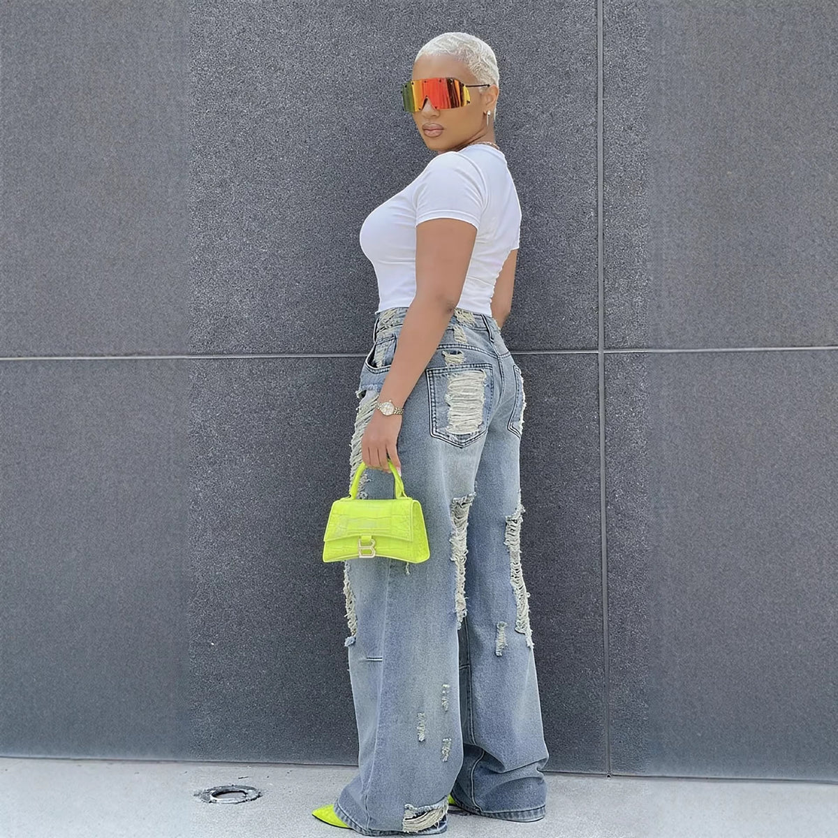 Washed straight-leg ripped jeans from Plush Fashion Hub featuring distressed details and casual fit.