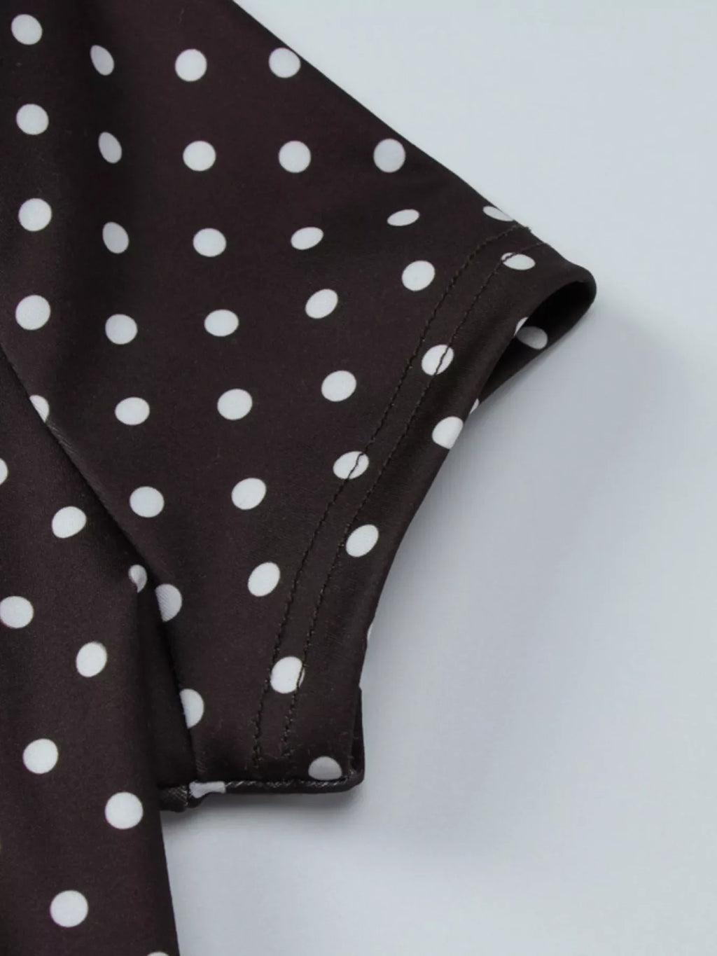 Polka dot cut-out front mini dress by Shopimist featuring a playful pattern and stylish design.