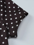 Polka dot cut-out front mini dress by Shopimist featuring a playful pattern and stylish design.