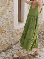 Women's cotton tiered frill V-neck sleeveless summer dress by Trendsi, featuring a flowy design with layered ruffles and a relaxed fit.