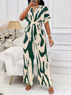 Abstract print wide-leg jumpsuit by Trendsi, stylish jumpsuit with flowing wide-leg design and vibrant abstract pattern.