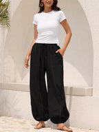 Casual loose fit harem joggers with drawstring waist from Trendsi, featuring a relaxed style and comfortable fit.