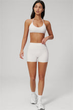 Fitglutes Activewear sports bra and shorts 2-piece set, gymwear and workout clothes, in black and white with athletic design.