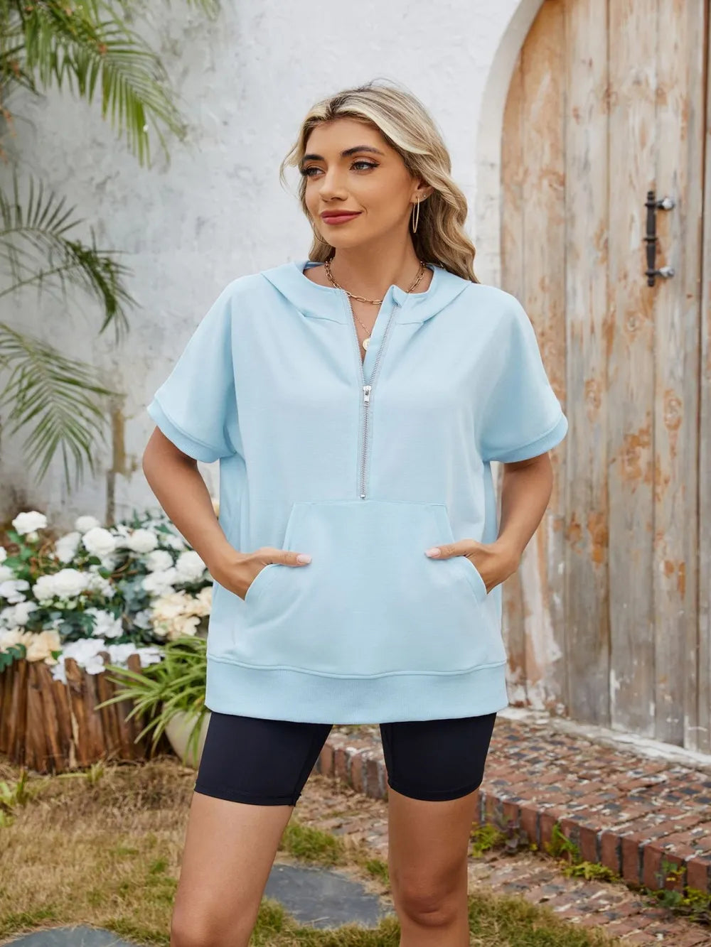 Light gray half zip short sleeve hooded top from Trendsi, featuring a casual fit and comfortable fabric.