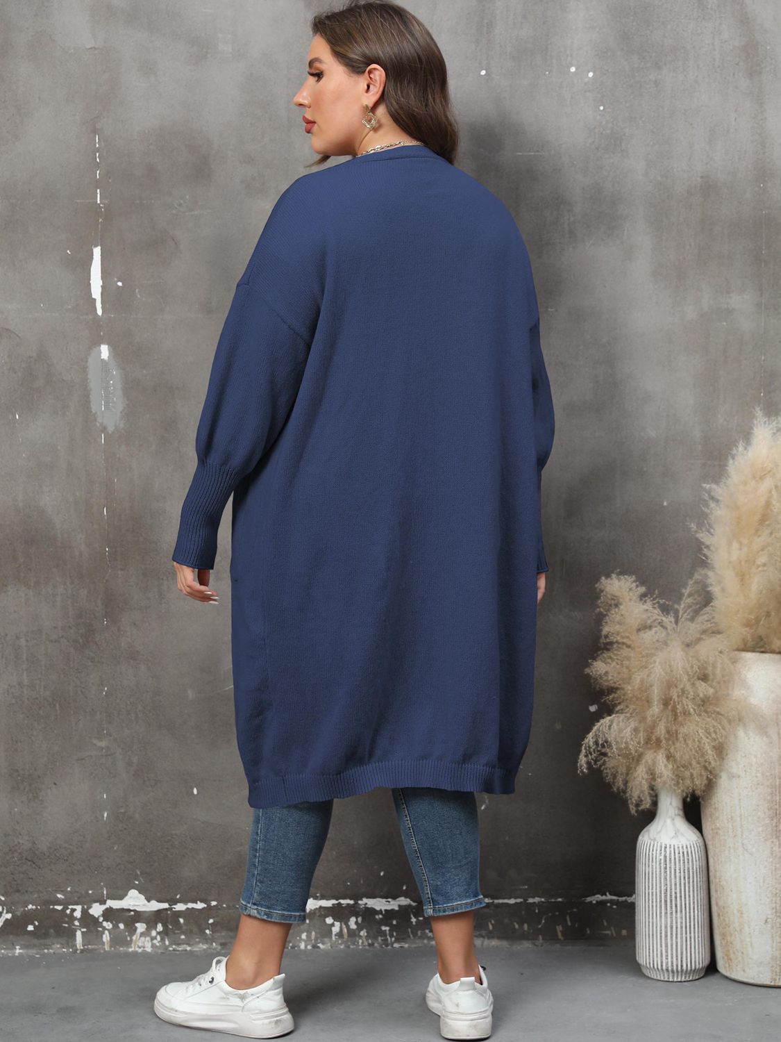Plus size long sleeve cardigan with front pockets from Shopimist, featuring a cozy knit design and a relaxed fit.